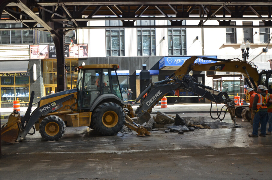 Workers performing utility work in Wabash Avenue in preparation for the station's demolition; March 10, 2015.
