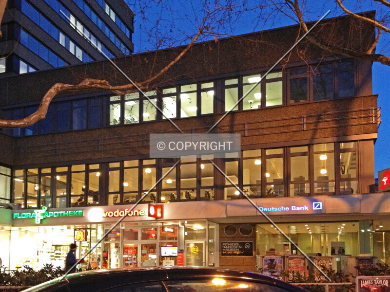 Deutsche Bank, vodafone Shop and a pharmacy